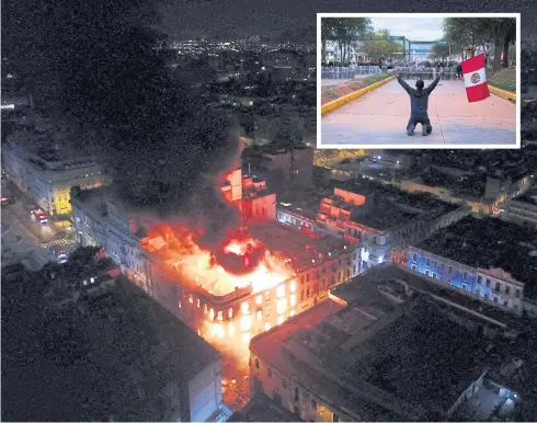  ?? PHOTOS BY REUTERS ?? Smoke and flames rise from a building during a march against Peru’s President Dina Boluarte on Thursday. Inset: A demonstrat­or holds a national flag, demanding new snap elections.