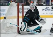  ?? NHAT V. MEYER — BAY AREA NEWS GROUP ?? Sharks goaltender Martin Jones blocks a shot against the Devils in the second period at SAP Center in San Jose on Feb. 27.