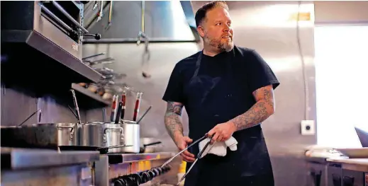  ?? [PHOTOS BY BRYAN TERRY, THE OKLAHOMAN] ?? Chef Jonathan Krell works in his kitchen at Patrono in Oklahoma City.