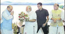  ?? PTI ?? PM Narendra Modi is greeted by BJP president Amit Shah and home minister Rajnath Singh in New Delhi on Monday.