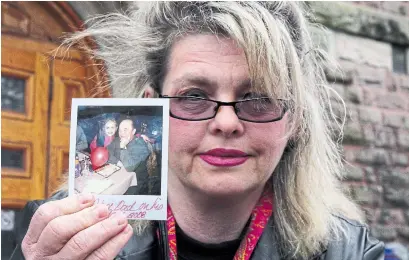  ?? DAVE CHIDLEY THE CANADIAN PRESS FILE PHOTO ?? Susan Horvath holds a photo of her father, Arpad Horvath, in April 2017. Her father was one of Elizabeth Wettlaufer’s eight victims.