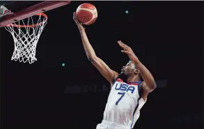  ?? Eric Gay / Associated Press ?? The United States’ Kevin Durant scores against France during the gold-medal game at the Olympics on Saturday.