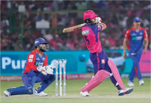  ?? Associated Press ?? ↑
Rajasthan Royals’ Riyan Parag plays a shot against Delhi Capitals during their IPL match.