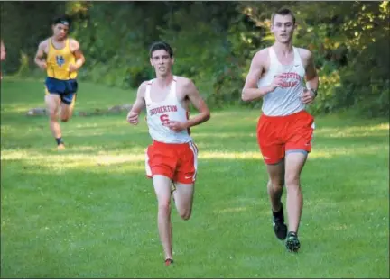  ?? GENE WALSH — DIGITAL FIRST MEDIA ?? Souderton’s Josiah Moyer (right) and Connor Williams take the lead during a meet against Upper Perk on Wednesday.