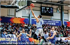  ?? ?? Luke Nelson leaps to score for Great Britain last night