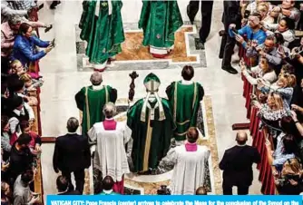  ??  ?? VATICAN CITY: Pope Francis (center) arrives to celebrate the Mass for the conclusion of the Synod on the Amazonia in Saint Peter’s Basilica in the Vatican yesterday. —AFP