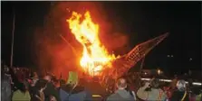  ?? DIGITAL FIRST MEDIA FILE PHOTO ?? A large crowd gathers to watch the wooden phoenix burn during the annual the Firebird Festival at Friendship Field in Phoenixvil­le.