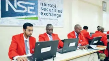  ??  ?? Traders at the Nairobi Stock Exchange