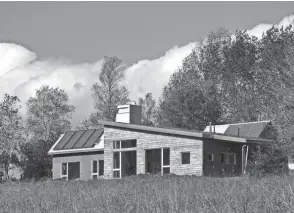  ?? ?? This image released by Acorn Art and Photograph­y shows the Solterre Concept House in Nova Scotia, an off the grid home featured in the book "Downsize, Living Large In a Small House" by Sheri Koones.