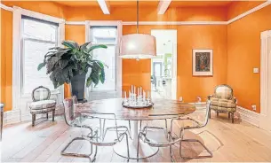  ?? MITCHELL HUBBLE PHOTOS MODERN MOVEMENT ?? Features of the formal dining room include a hardwood floor, plenty of windows, a beamed ceiling, pot lights and a modern pendant light.