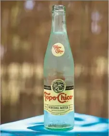  ?? Ilana Panich-Linsman photos / New York Times ?? The bubbly beverage bottled in Monterrey, Mexico, has gained popularity in Texas. The retro bottles of mineral water can be found from taco stands to high-end eateries.