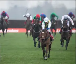  ?? Pic: Pic: Edward Whitaker/Racing Post ?? ClothCap powers clear on the way to victory in the Ladbrokes Trophy