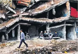  ??  ?? A city in ruins: McCurry’s shot of a bomb- damaged street in Kabul in 2002