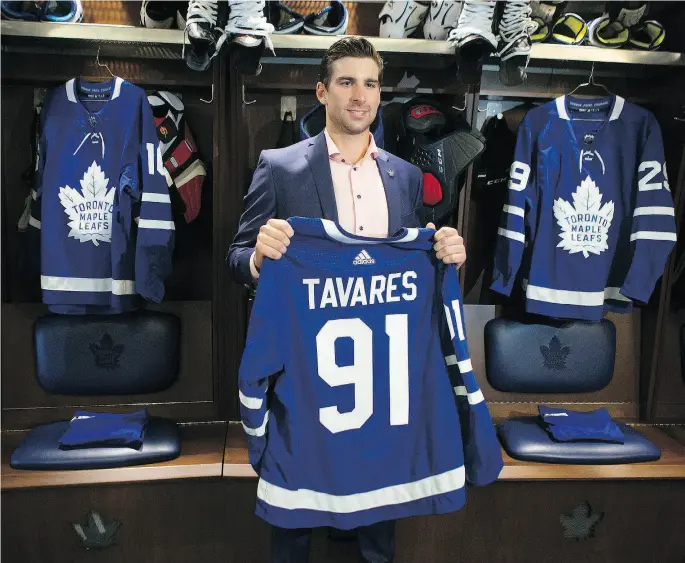 ?? CHRIS YOUNG / THE CANADIAN PRESS ?? John Tavares signed a seven-year, US$77-million deal with the Maple Leafs on Sunday. “I just had the feeling this was the right fit for me,” he said.