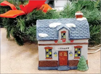  ?? Lynn Atkins/The Weekly Vista ?? The Bella Vista Library has received many pieces of lighted Christmas villages that will be displayed at its new Christmas event, "Christmas at Dickens Place."