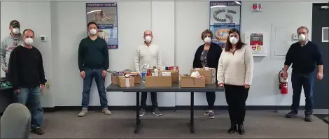  ?? PHOTO SUBMITTED BY SUSAN ROEBUCK ?? Employees of Rush Gears Inc. of Fort Washington recently contribute­d many “wish list” food items to the Mattie N. Dixon Community Cupboard located in Ambler.