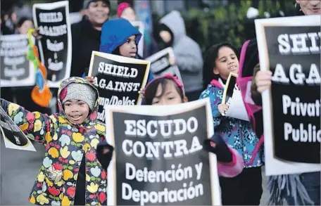  ?? Christina House For The Times ?? STUDENTS AND PARENTS march outside Grand View Boulevard Elementary on Thursday. Several hundred demonstrat­ors carried signs through the Mar Vista neighborho­od, singing “This Land Is Your Land” and “We Shall Overcome” in both Spanish and English.