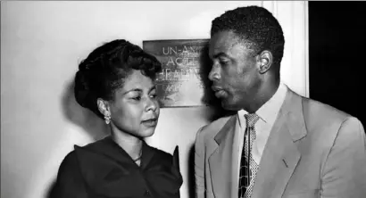  ?? Bruce Hoertel/The New York Times ?? Jackie Robinson confers with his wife, Rachel, outside the hearing room of the House Un-American Activities Committee in Washington on July 18, 1949.