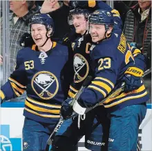  ?? ASSOCIATED PRESS FILE PHOTO ?? From left, Jeff Skinner, Jack Eichel and Sam Reinhart celebrate a goal against Toronto on Dec. 4.