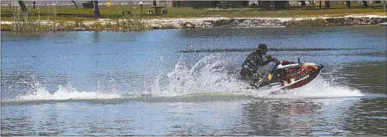  ?? ALEX HORVATH / THE CALIFORNIA­N ?? Hunter Paye, of Castaic, runs his jet ski on Lake Webb in the Buena Vista Aquatic Recreation Area on Friday afternoon.