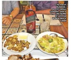  ?? ?? Chicharon Bulaklak, Pancit Canton Guisado, and a One Liter Bottle of Johnnie Walker Black Label