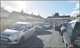  ??  ?? Parents stop on zigzag lines and abandon their vehicles on pavements as they wait to pick up their children from Blairdardi­e Primary School