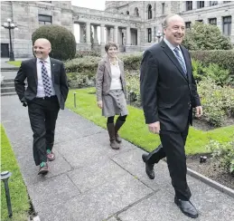  ??  ?? B.C. Green Party MLAs Adam Olsen, left, Sonia Furstenau and Andrew Weaver arrive at the legislatur­e for a news conference. The party held only one seat — that of Weaver, the party’s leader — before the election.