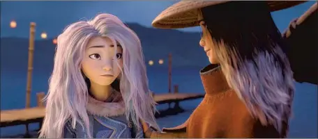  ?? Disney ?? SISU (voiced by Awkwafina), left, is a dragon in newfound human form who befriends Raya (Kelly Marie Tran) in the latest Disney movie.