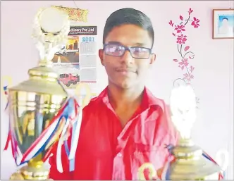  ?? Picture: ATU RASEA ?? Vimal Deo of Koronivia, Nausori holds trophies which he won at bhajan competitio­ns.