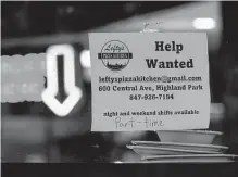  ?? Nam Y. Huh/associated Press ?? A hiring sign is displayed earlier this year at a restaurant in Highland Park, Ill. Restaurant­s and bars added 62,000 jobs last month, helping to intensify pressure on the Federal Reserve.