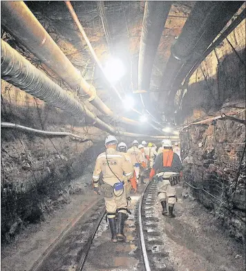  ?? PHOTO: ITUMELENG ENGLISH ?? Miners walk along level 33 at Sibanye Gold’s Ya Rona shaft near Carletonvi­lle.