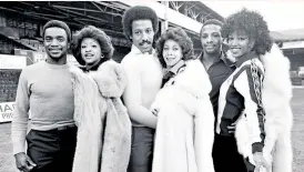  ??  ?? Star performers: The Three Degrees meet up with their football namesakes (from left) Laurie Cunningham, Brendan Batson and Cyrille Regis