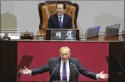  ?? LEE JIN-MAN / POOL ?? In front of the South Korean National Assembly, Donald Trump called on all nations to join forces “to isolate the brutal regime of North Korea — to deny it any form of support, supply, or acceptance.”