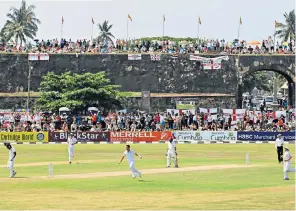  ??  ?? Top, India’s captain Virat Kohli scores a century at Galle in July, in a match referred to in ‘fix’ claims. England, pictured right, playing at the ground last March