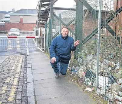  ?? Pictures: Paul Reid. ?? Ralph Coutts next to litter behind the signal box at Arbroath Railway Station.