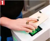  ??  ?? Shopper swipes phone with the Amazon Go app on screen across a sensor which releases a gate to let them into store