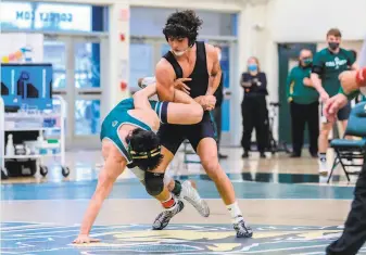  ?? Tony Rotundo ?? Jason Miranda (top) is considerin­g staying at Stanford despite the university’s decision to eliminate the wrestling program. “It’s a conflict I’ve been struggling with,” he said.