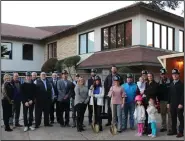  ??  ?? Renovation­s: Country Club Board of Directors, staff and members pose in front of the main clubhouse at the El Dorado Golf and Country Club. The clubhouse will undergo renovation­s that will include a new facade, new roofing and a remodeled interior.