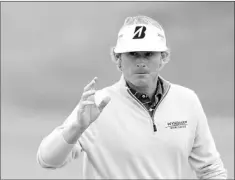  ?? — Photo by The Associated Press ?? Snedeker (shown above) tied the course record at Royal Lytham with a 6-under 64 that gave him a one-shot lead at the British Open and has yet to make a bogey over 36 holes. What’s more, his two-day score of 10-under 130 matches the 36-hole Open record...
