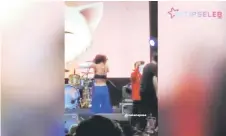  ?? YouTube/ IntipSeleb Official — Screenshot via ?? Widi Viarratale is being investigat­ed by police after she removed her t-shirt revealing her sports bra when performing in a concert.