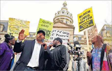  ?? Amy Davis
Baltimore Sun ?? AT BALTIMORE CITY HALL, protester Edward Brown speaks about the death of Freddie Gray, a 25-year-old black man.