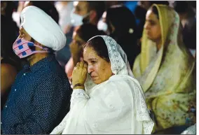  ??  ?? Harjinder Kaur Sodhi, wife of murder victim Balbir Singh Sodhi, wipes a tear away.