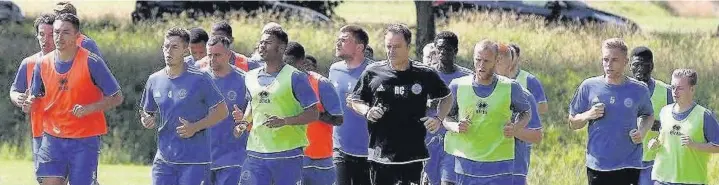  ??  ?? The Shots are put through their paces by fitness coach Russ Clash as they prepare to open their pre-season account with the visit of the Chelsea Under 21s on Friday night.
PICTURE BY IAN MORSMAN