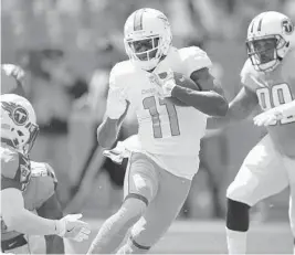  ?? AP/FILE ?? Wide receiver DeVante Parker (11) helped the Dolphins defeat the Tennessee Titans on Oct. 8, one of the teams’ four wins this season.
