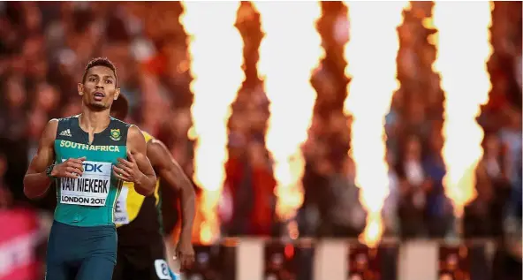  ??  ?? All fired up: Wayde van Niekerk of South Africa easily won the 400m final. — Reuters