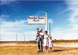  ?? Courtesy Anne Marie Miller ?? Anne Marie Miller and her parents pictured outside of their church. Her family’s life revolved around the church.