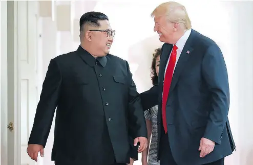  ?? AFP / KCNA VIA KNS ?? North Korea’s leader Kim Jong Un and U.S. President Donald Trump at their historic summit earlier this week. For all the hype about the meeting in Singapore, we’ve been here before, Terry Glavin writes.