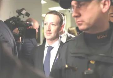  ??  ?? Zuckerberg exits after a meeting on Capitol Hill in Washington, D.C., last Monday. Zuckerberg, in prepared testimony, said all of Facebook’s problems are his mistake.