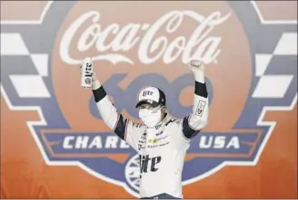  ?? Gerry Broome / Associated Press ?? was disqualifi­ed, but Elliott was just
Brad Keselowski celebrates winning the Coca-cola 600 early Monday. Runner-up Jimmie Johnson had his finish thrown out by NASCAR after his car failed inspection.