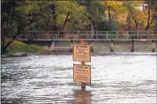  ??  ?? Signs warn off anglers near the Mokelumne River Fish Hatchery in Clements in San Joaquin County.